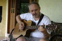Old buzzard playing guitar