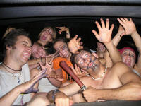 wild painted youth in back of Suburban